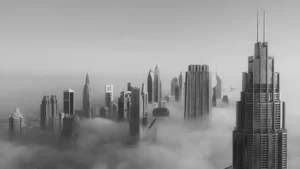 Dubai skyscrappers within a misty and cloudy atmosphere in black and white images
