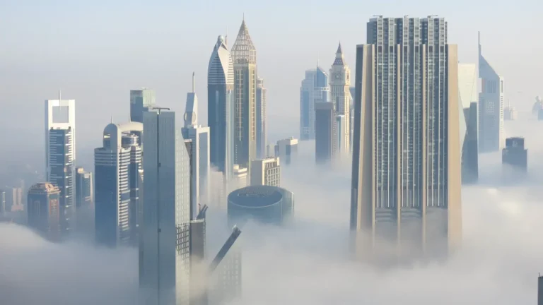 Dubai skyscrappers within a misty and cloudy atmosphere