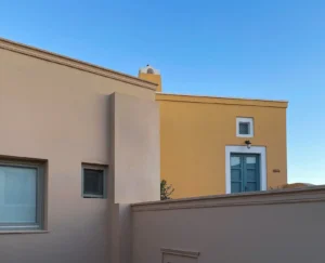 Sepia yellow house with a blue door